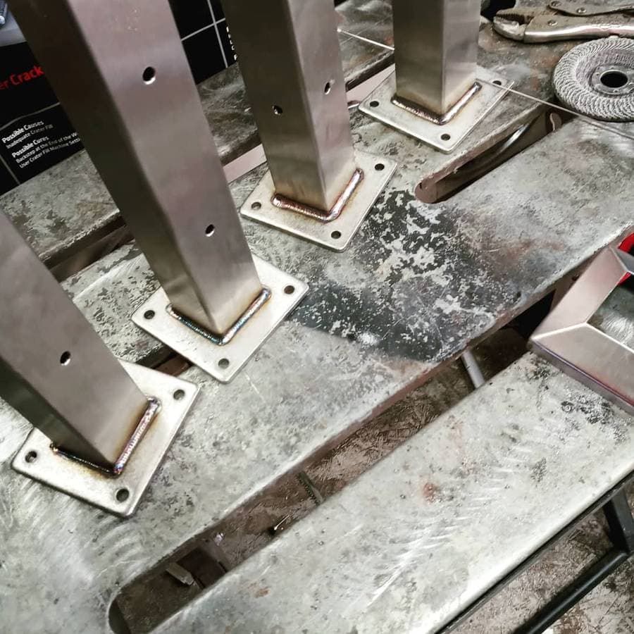 Pieces of metal welded together to form structural beams